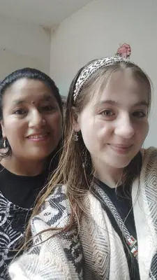 two young girls are posing for a picture at Hostel Imperial BACKPACKER in Cusco