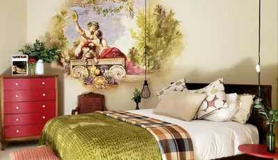 a bedroom with a bed and a painting on the wall at Niños Hotel Fierro in Cusco