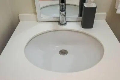 a white sink with a faucet on top of it at Ocean View Beautiful Aparment in Lima