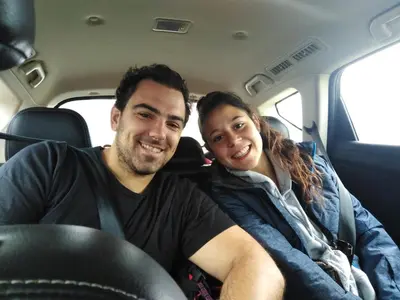 a man and a woman sitting in a car at Hospedaje de Lidia in Lima