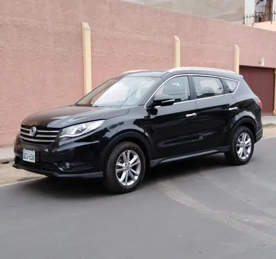 a black car parked in a parking lot at Hospedaje de Lidia in Lima