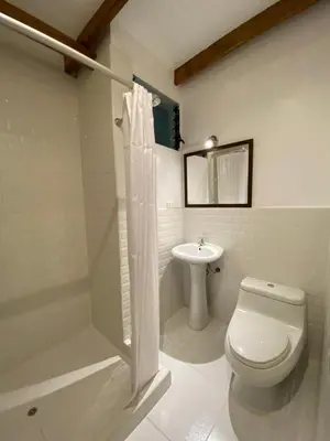 a bathroom with a toilet and a sink at Mistico Machupicchu Eco B&B in Machu Picchu
