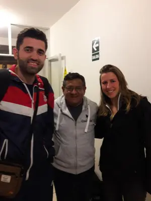 two men and a woman posing for a picture at Hospedaje el Telar in Nazca