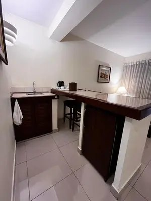 a kitchen with a counter top and a sink at Hotel Boulevard in Lima