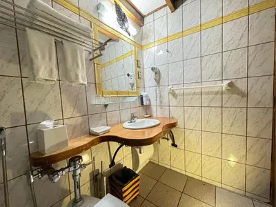 a bathroom with a sink and a shower at ARQUEOLOGO Exclusive Boutique Hotel Cusco - Centro Histórico in Cusco