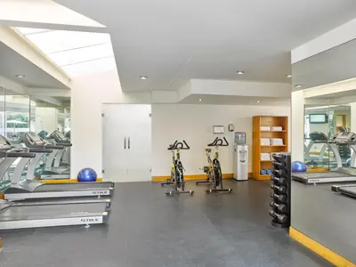 a gym with cardio machines and exercise bikes at Hotel Estelar Miraflores in Lima