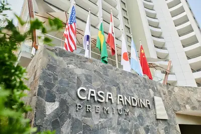 a sign in front of a building with flags at Casa Andina Premium Golf Los Incas in Lima