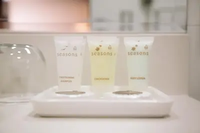 a set of four candles on a white counter at Hotel Carrera in Lima
