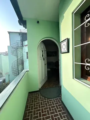 a hallway of a building with a white door at Departamento en San Isidro in Lima