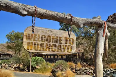 a sign that reads home in chihuahua at Hotel Gran Palma Huancayo in Huancayo