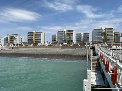 a bridge over the water with buildings in the background at ooo OCEAN VIEW APARTMENT PARACAS SOTAVENTO ooo in Paracas