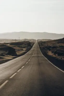 an empty road in the middle of the desert at Paracas vista al mar in Paracas