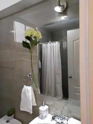 a bathroom with a sink and a mirror at Elite Apartment 2 in Cusco