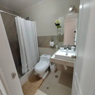 a bathroom with a toilet and a sink at Elite Apartment 2 in Cusco