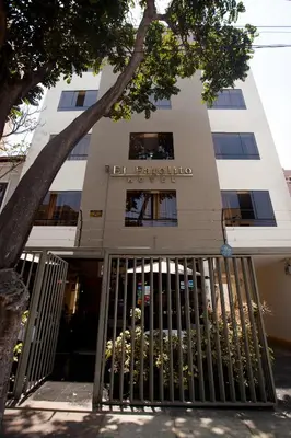 a building with a gate in front of it at Hotel El Farolito in Lima
