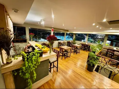a restaurant with tables and chairs in a room at Tikala Cusco Boutique Hotel in Cusco