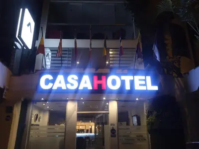 a casa hotel sign lit up at night at CasaHotel Jockey Plaza Mall in Lima