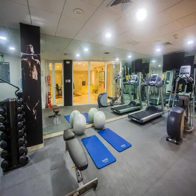 a gym with a lot of exercise equipment in it at Del Pilar Miraflores Hotel in Lima