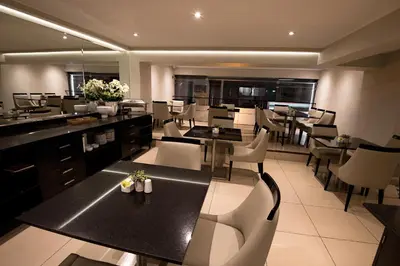 a dining room with tables and chairs in a restaurant at Mariel Hotel Boutique in Lima