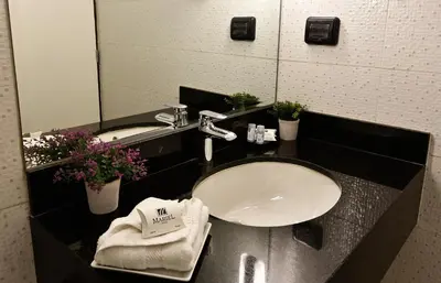 a bathroom with a sink and a mirror at Mariel Hotel Boutique in Lima
