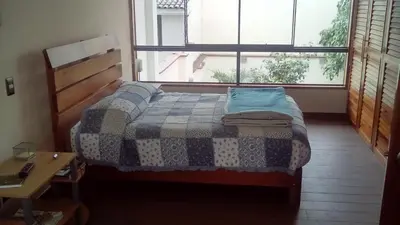 a bedroom with a bed and a window at Hospedaje La Anita in Lima