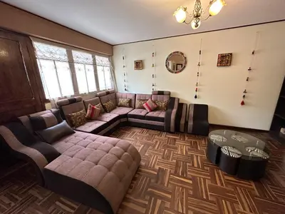 a living room with couches and a couch and a table at Euler House`s in Cusco