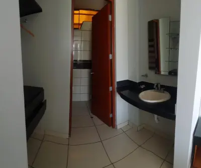 a bathroom with a sink and a mirror at Regency Plaza Hotel in Pisco