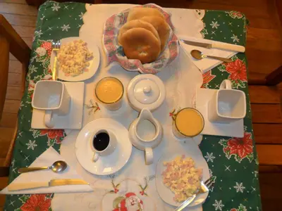 a table with a table cloth with food on it at Chaquill Chak'a in Cusco