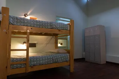 a bedroom with two bunk beds in a room at Wild Olive Guest House in Ica