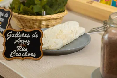 a table with a plate of cheese and a sign at 7 Toritos Hotel Boutique by Hacienda in Cusco