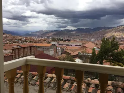a view of a city from a balcony at 7 Toritos Hotel Boutique by Hacienda in Cusco