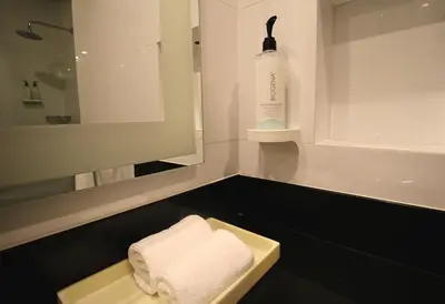 a bathroom with a sink and a bottle of soap at Hilton Garden Inn Lima Surco in Lima