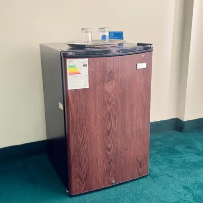 a wooden refrigerator sitting in a room at Hotel La Molina in Lima