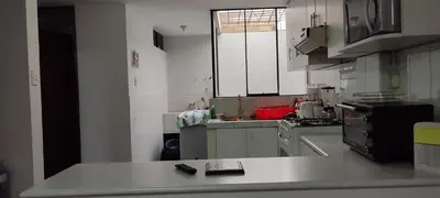 a kitchen with a sink and a counter top at Apartamento Marco Airport in Lima