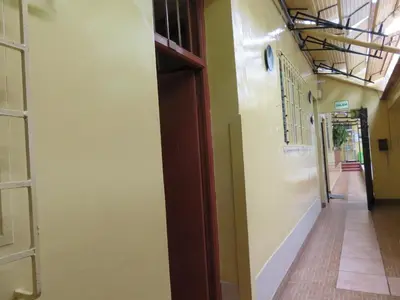 an empty hallway with a door in a building at Hospedaje Del Pilar en Magdalena del Mar in Lima