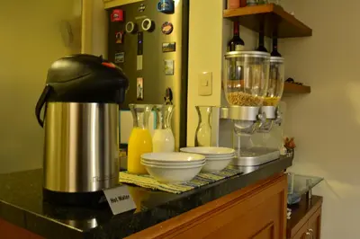 a kitchen counter with a blender and other ingredients at Kangaroo Wasi Airport Bed & Breakfast in Lima