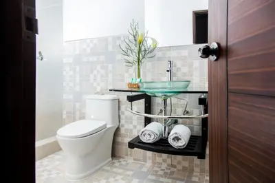a bathroom with a toilet and a sink at Hotel Casa Fierro Cusco in Cusco