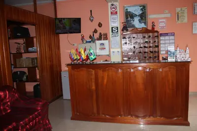 a wooden bar in a room with a counter at Hotel Mi Casa in Ayacucho