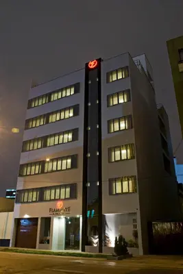 a building with a clock on the top of it at Flamante Hotel & Suite in Lima