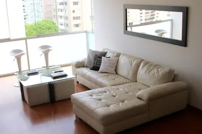 a living room with a couch and a table at InkaHuset Miraflores Deluxe in Lima