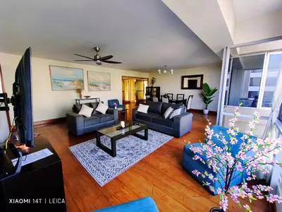 a living room with two couches and a tv at Oceanfront Miraflores Larcomar next to Marriott in Lima