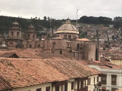 a view of a city with buildings and roofs at Del Niño Apartment, Best location in Cusco