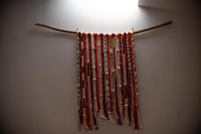 a bunch of beads hanging on a wall at Casita Huaran in Calca