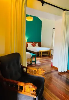 a living room with a couch and a bed at Usgar San Pedro Boutique in Cusco