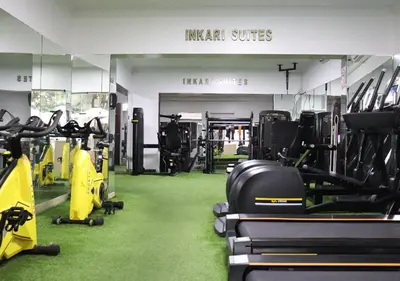 a gym with treadmills and exercise equipment in it at Inkari Suites Hotel in Lima