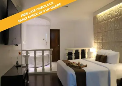 a bedroom with a large white bed in a room at Inkari Suites Hotel in Lima