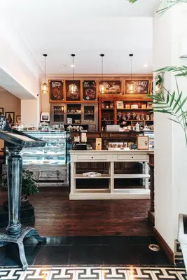 a restaurant with a counter in the middle of a room at Hotel Antigua Miraflores in Lima