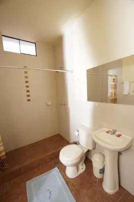 a bathroom with a toilet and a sink at Casa Union Cusco in Cusco