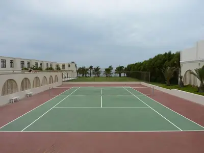 a tennis court on top of a building at La Hacienda Bahia Paracas in Paracas