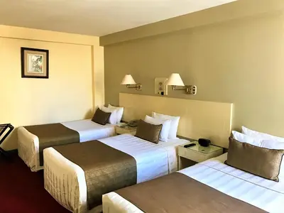 a hotel room with two beds in a room at Embajadores Hotel in Lima
